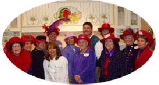 Red Hat Ladies posing for their cooking class picture